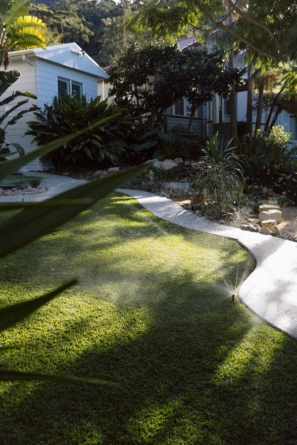 Active irrigation across a healthy lawn — irrigation servicing and lawn care Wollongong