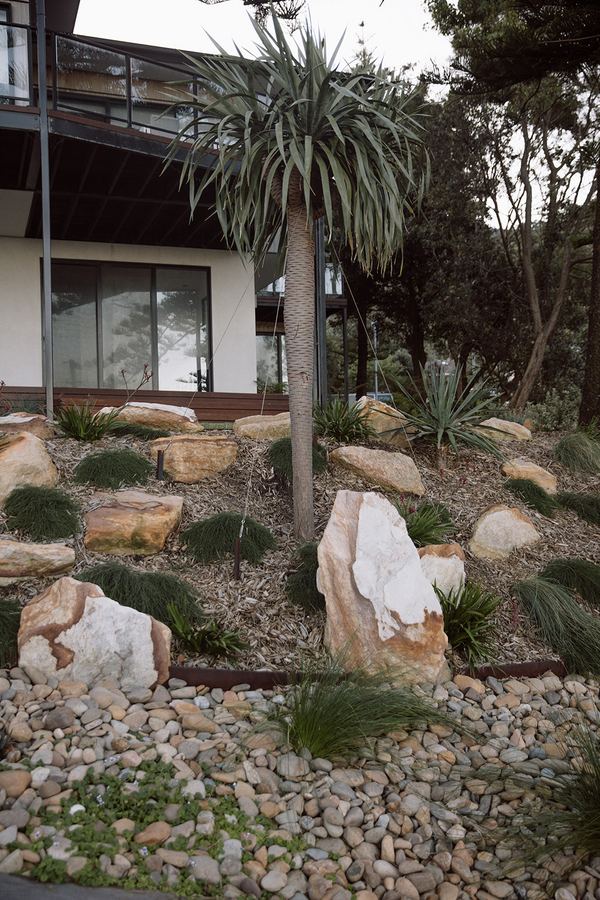 Landscaped hillside of succulents and rock — slope garden care Illawarra escarpment